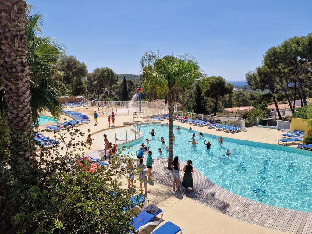 a group of people in a swimming pool at a resort at Camping de Ceyreste - Maeva in La Ciotat
