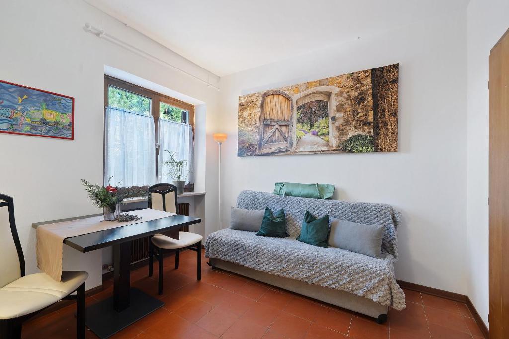 a living room with a couch and a table at Katharina in Lana