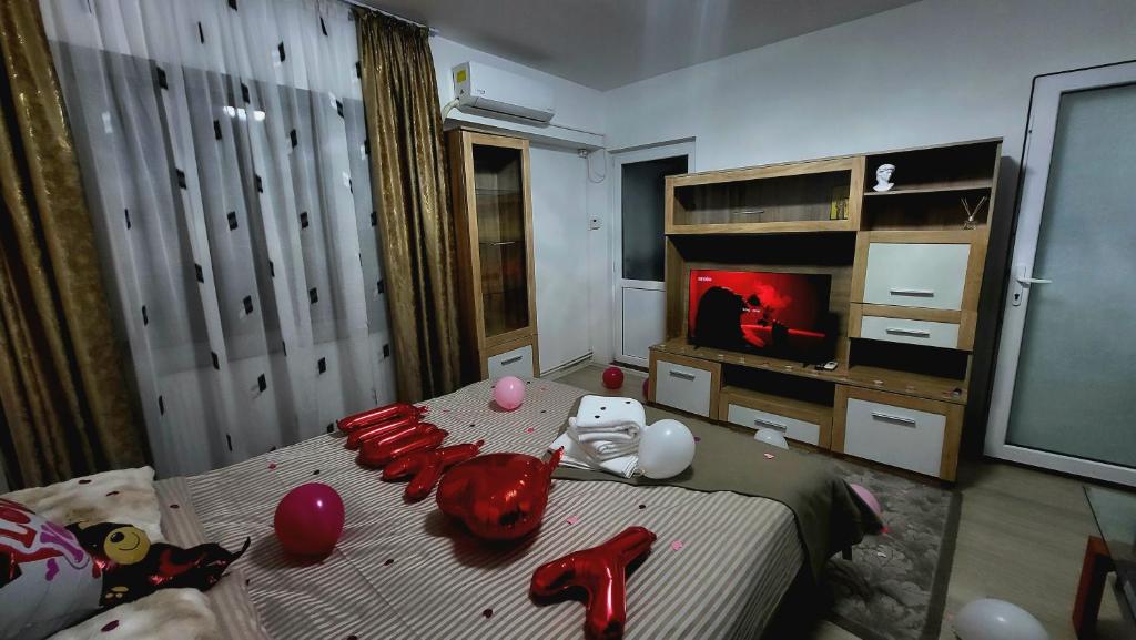 a bedroom with a bed with toys on it at Mazepa 2 You in Galaţi