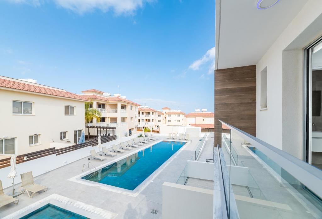 a view of the pool from the balcony of a house at Rons House in Paralimni