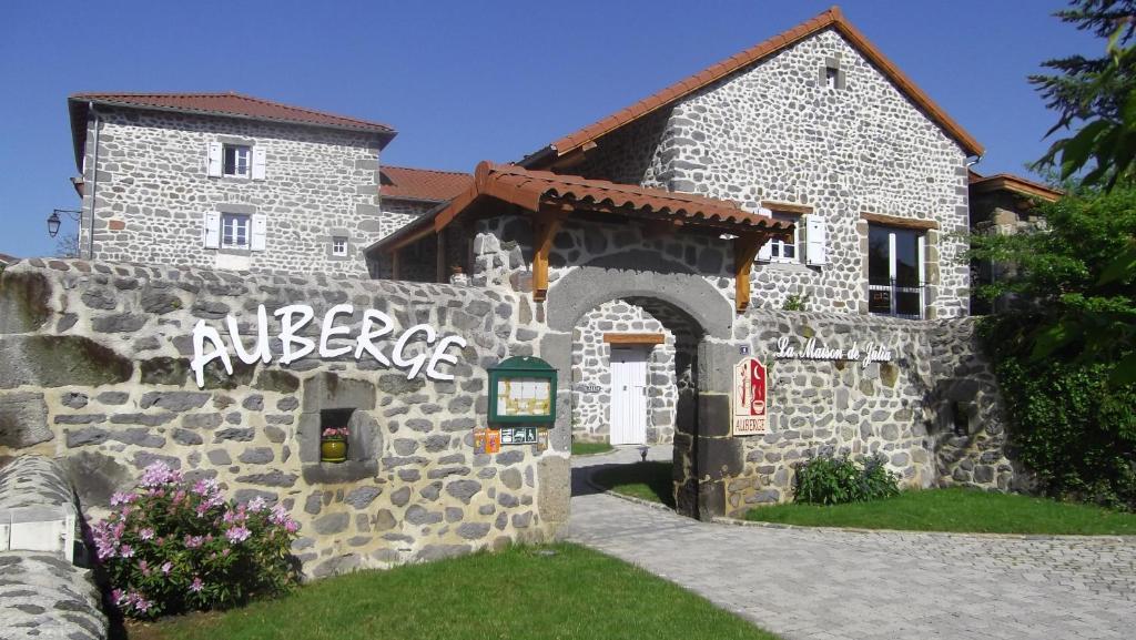 a stone building with the wordabuse written on it at La Maison de Julia in Blanzac