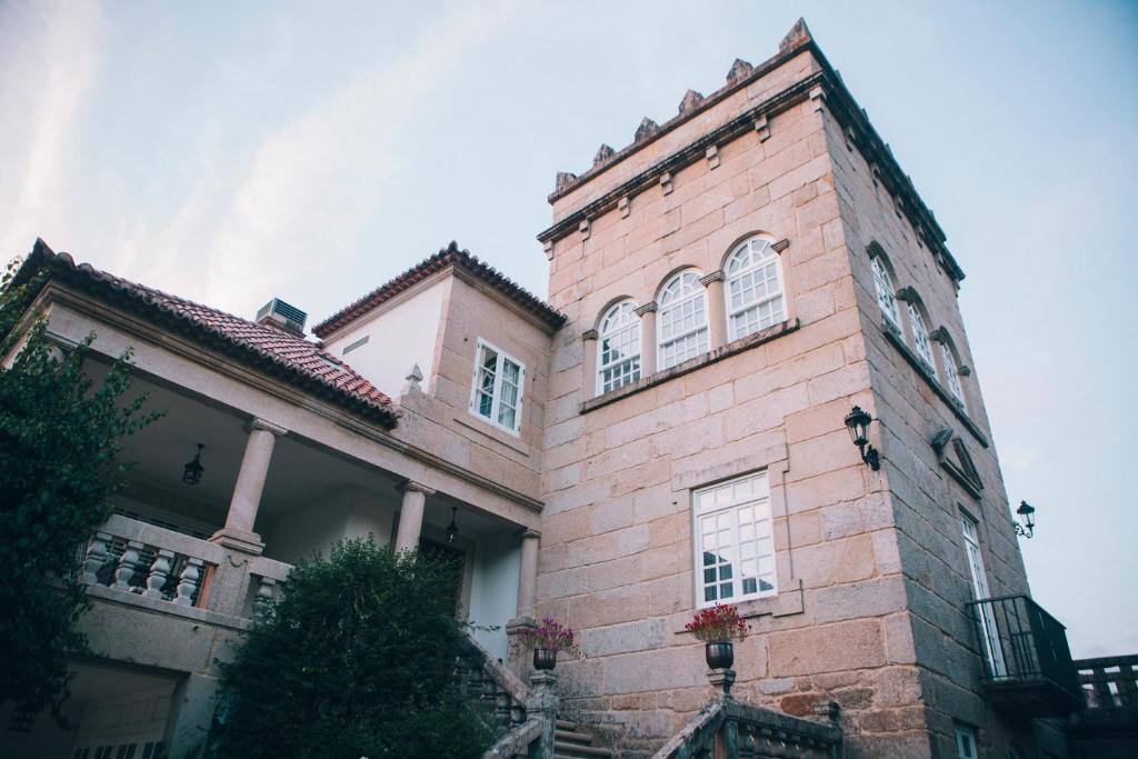 a large brick building with windows on the side of it at Pazo Santa Teresa in Redondela