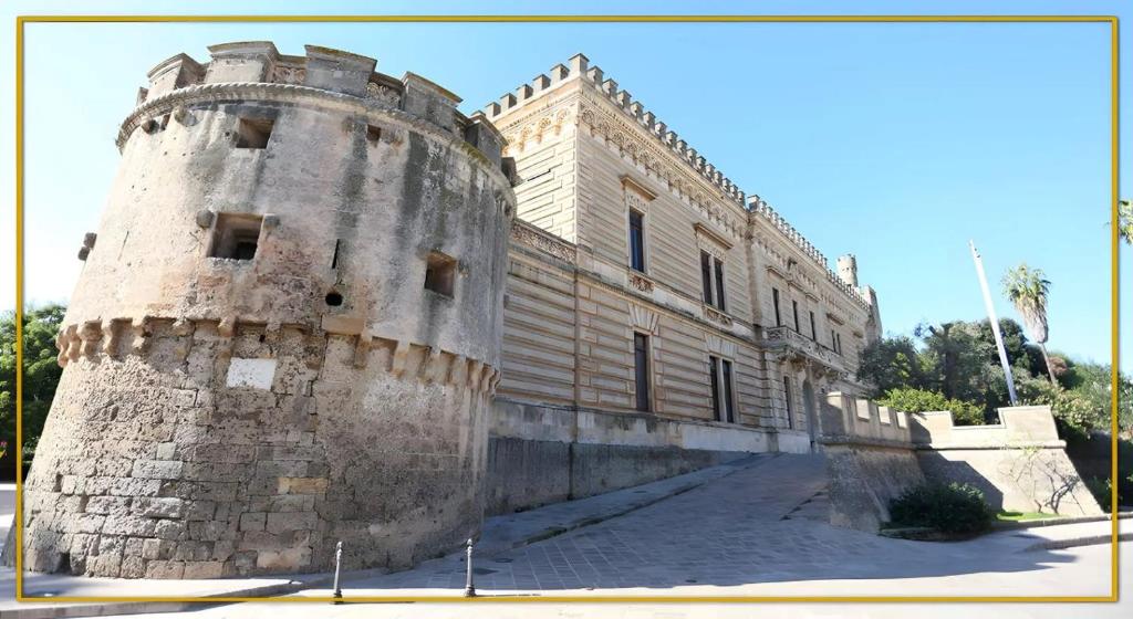 a large stone building with a tower at mono volta by salentolimit in Nardò