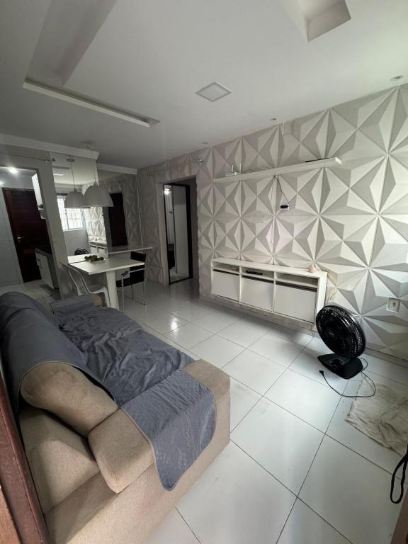 a bedroom with a bed and a desk in a room at Apto Tranquilo próx ao Litoral Sul Wi-Fi in João Pessoa