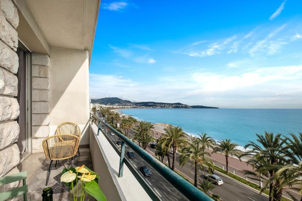 a balcony with a view of the ocean at Baie des Anges in Nice