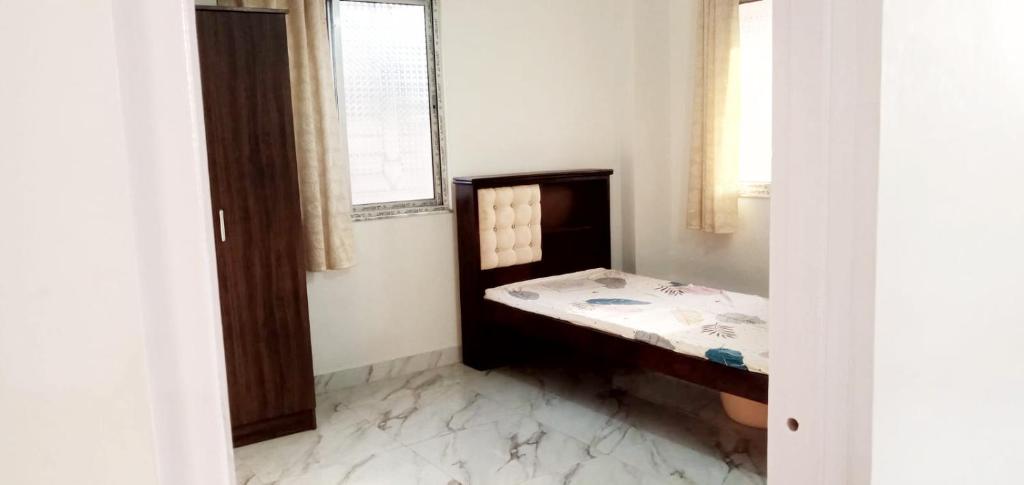 a small room with a table and a window at Mayapur in mayapur