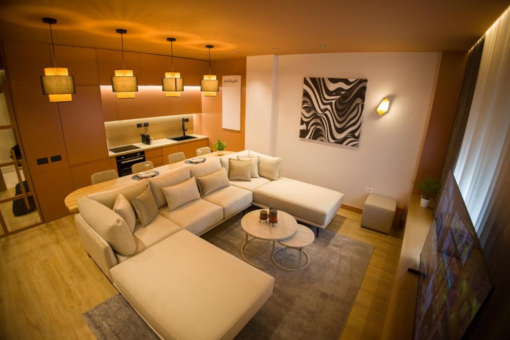 a living room with a couch and a table at Solen Suites in Korçë