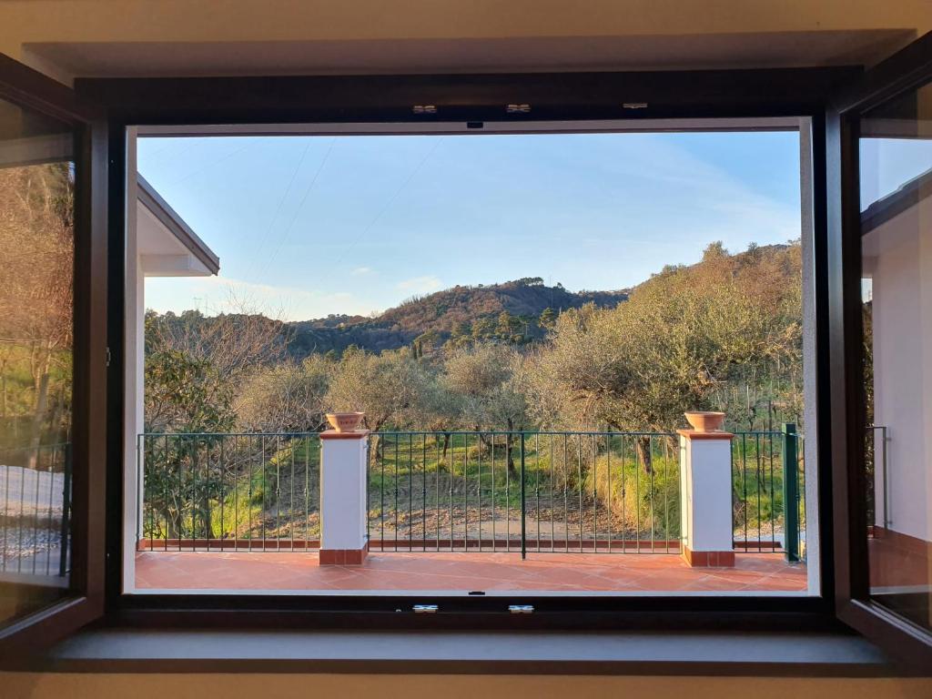 a window with a view of a balcony at Il Grottino di Sarzana in Sarzana