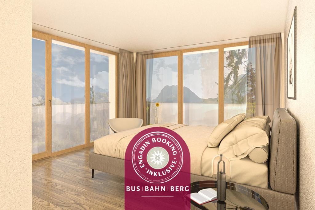 a bus balmain bee sign in a bedroom with a bed at Plavna Apartment in Scuol