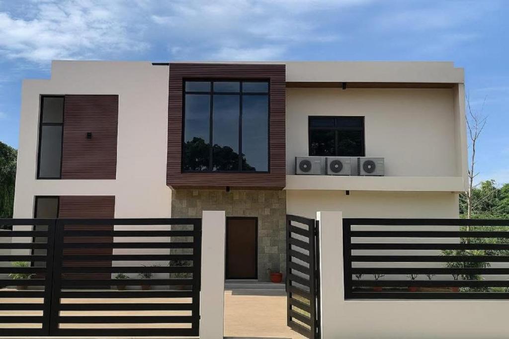 a house with two speakers on the front of it at Lindelle Place Palawan in Puerto Princesa City