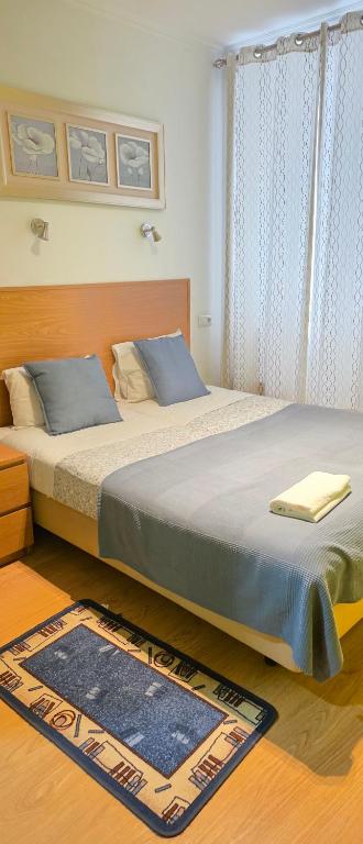 two beds sitting next to each other in a bedroom at Baixa GuestHouse in Lisbon