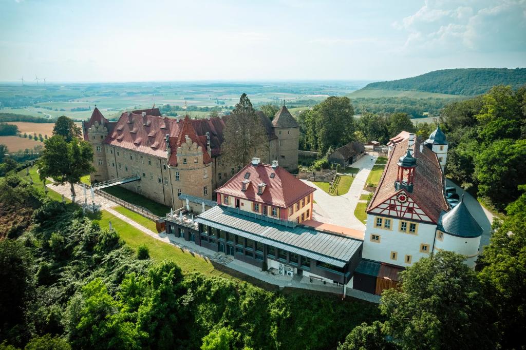 an aerial view of a castle on a hill at Schloss Frankenberg in Weigenheim