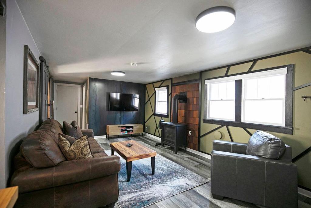 a living room with a couch and a table at Rose Park Hideaway in Missoula