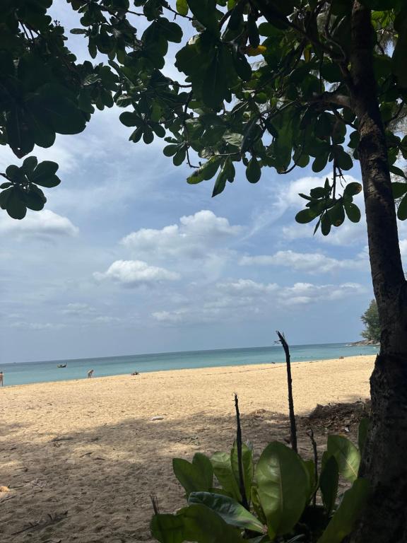 a view of a beach with people in the water at Wyndham studio 2205 in Surin Beach