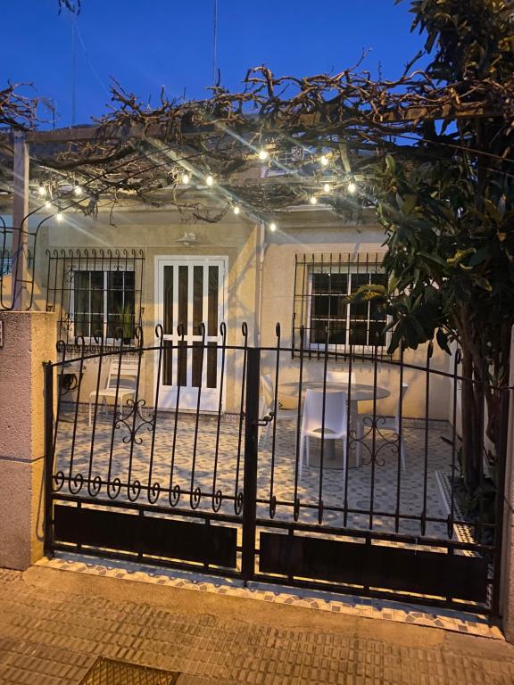 a gate to a house with lights on it at Angeleyes in San Pedro del Pinatar