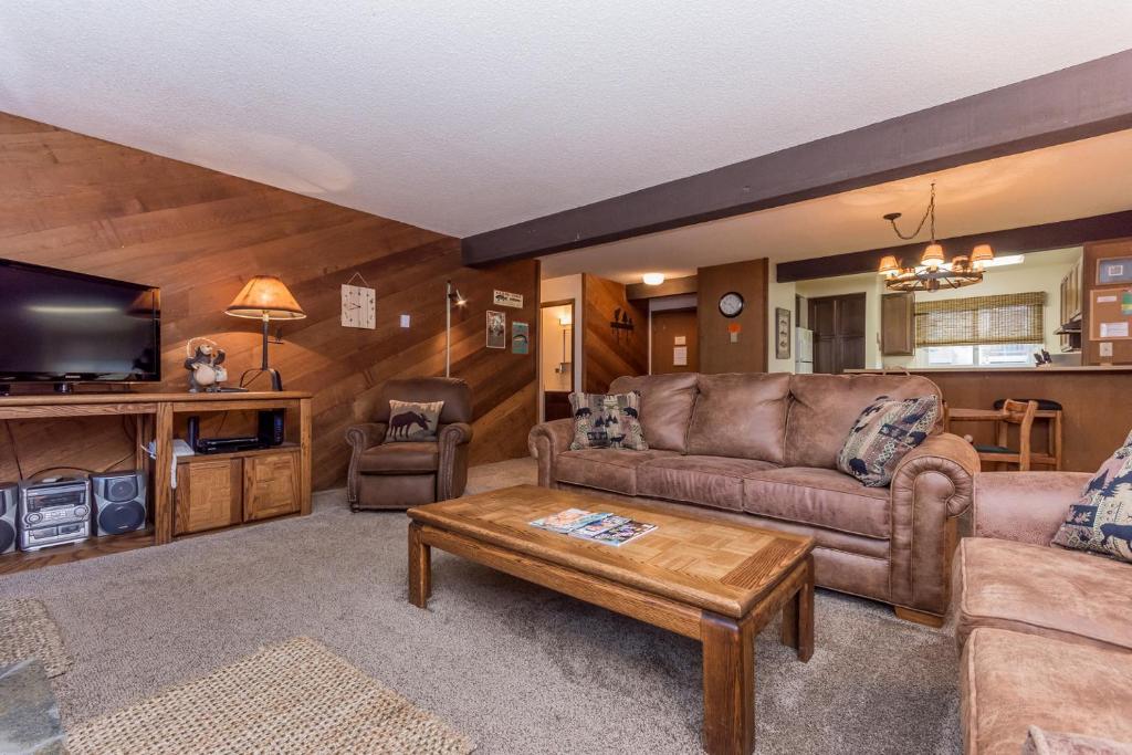 a living room with a couch and a coffee table at Mammoth Creek Unit 15 in Mammoth Lakes