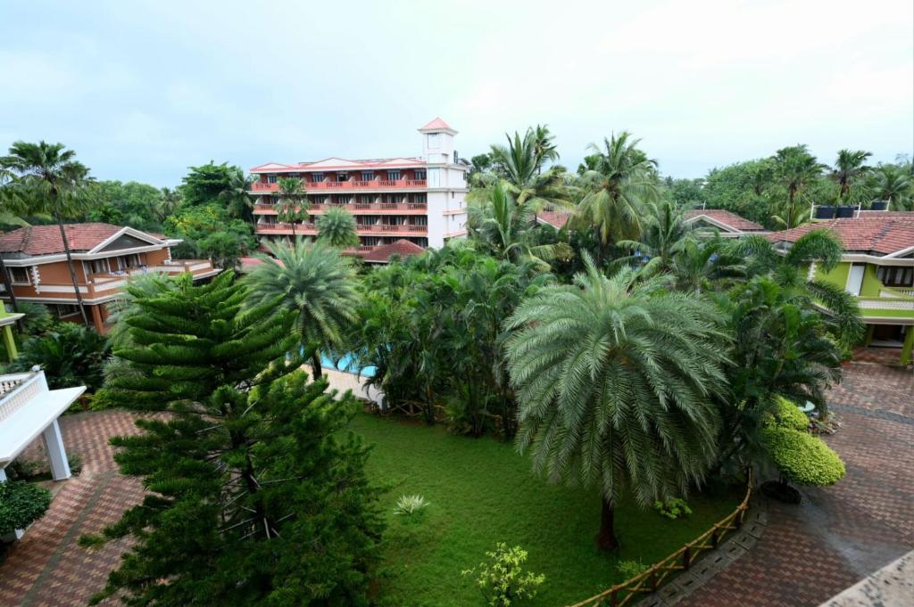 an aerial view of a resort with palm trees at Scandi-Stay 2BR by Benaulim Beach in Benaulim