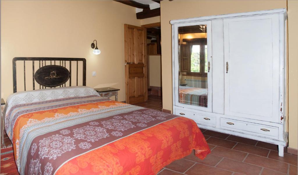 Postel nebo postele na pokoji v ubytování El Mijolar Apartamentos