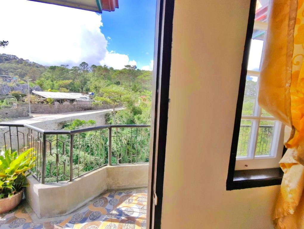 a view from a window of a balcony at Sagada Staycation with Mountain View - 1st Floor in Sagada