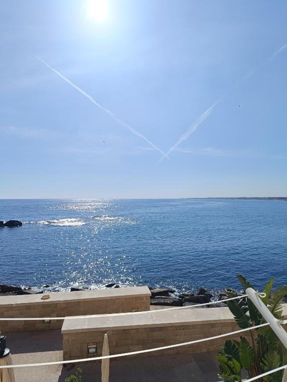 a view of the ocean from a building at Virgin Mare in Giovinazzo