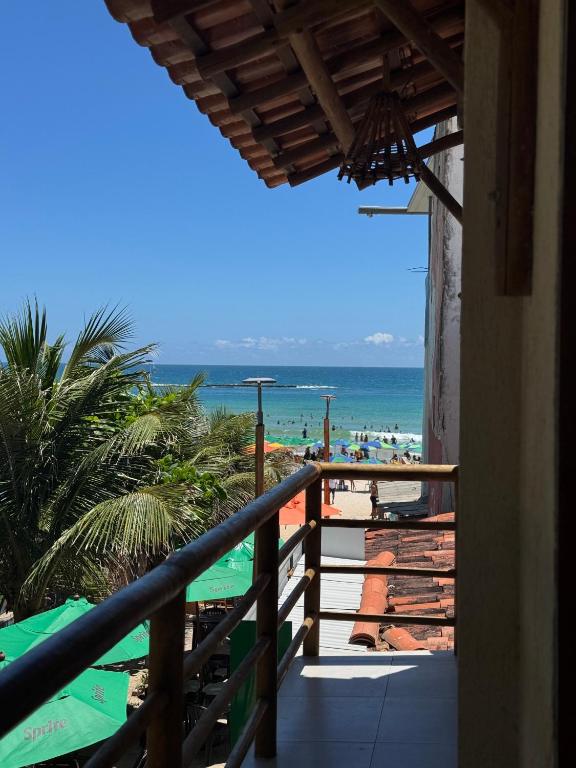 a view of the beach from the balcony of a resort at Casa Vista Mar - Praia do Frances in Marechal Deodoro