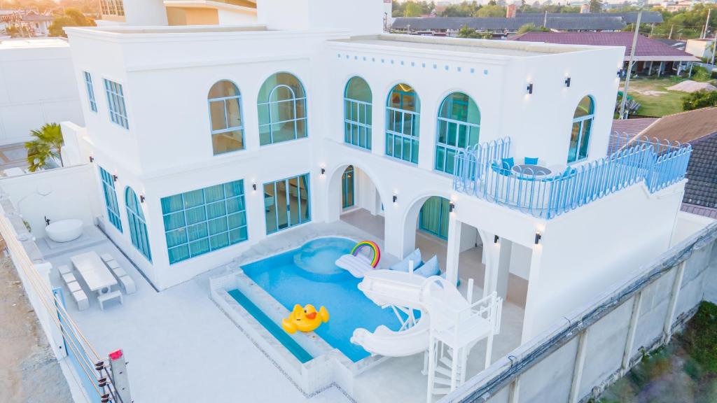 an aerial view of a house with a swimming pool at Blue Tierra Pool Villa Pattaya in Ban Hua Phrong