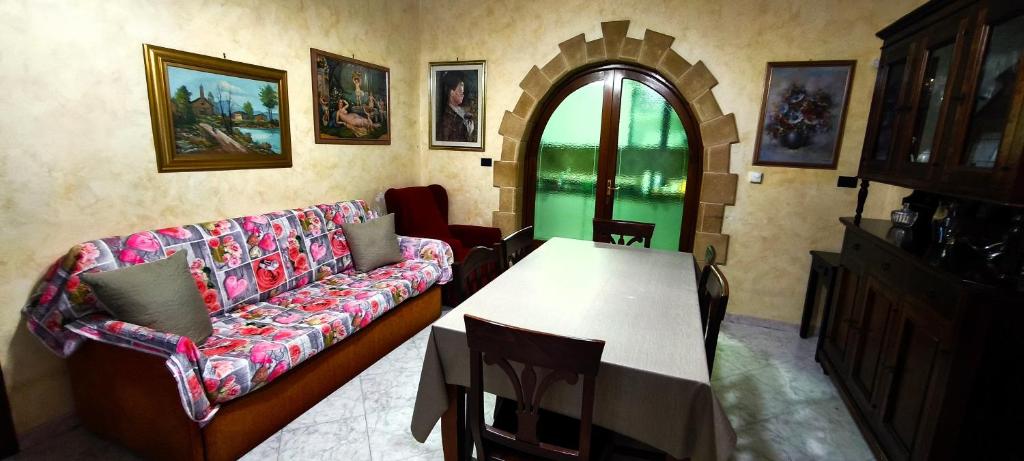 a living room with a couch and a table at Casa Antonietta in Aradeo