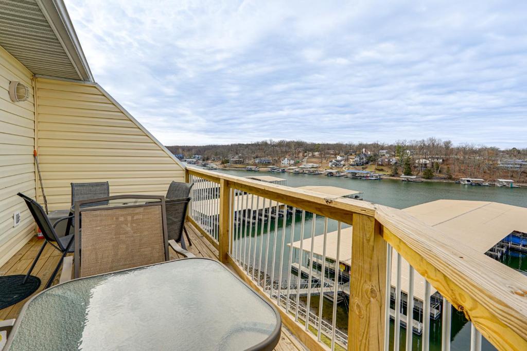 a balcony with chairs and a view of the water at Pool & Beach Access: Lake of the Ozarks Condo in Osage Beach
