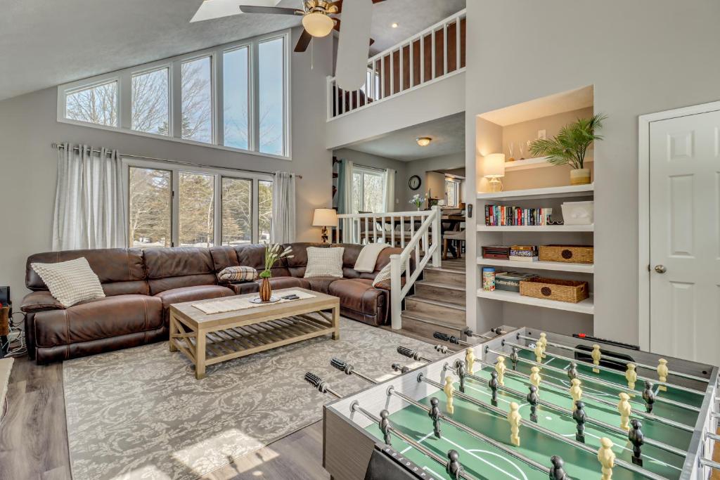 a living room with a couch and a table at Contemporary House in Lakeside Community! Poconos in Albrightsville