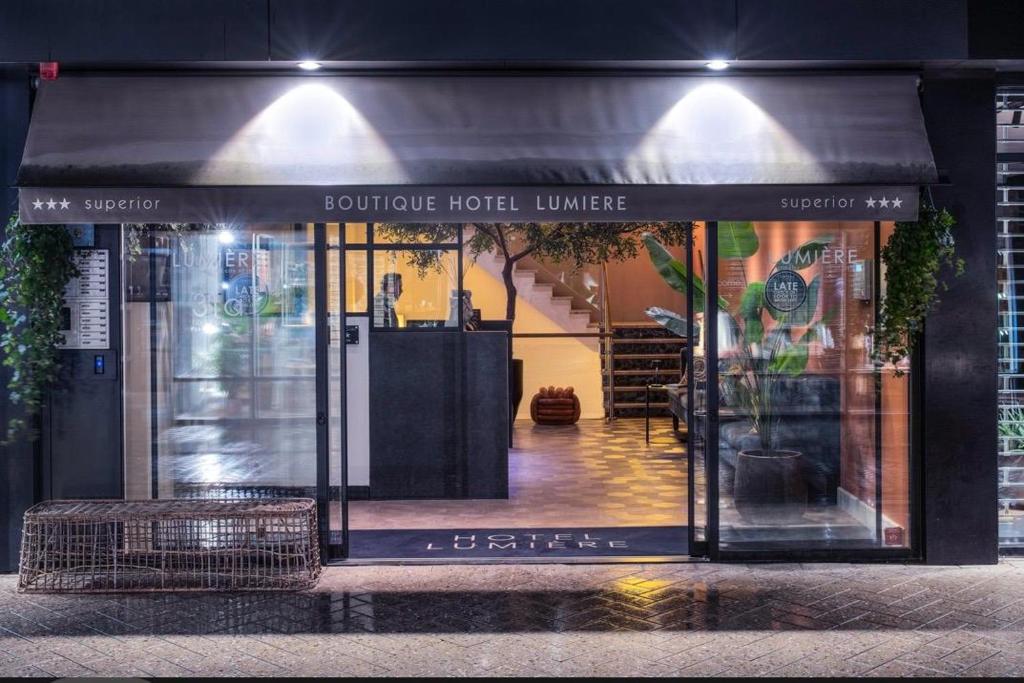 a store front with a black awning on a street at Boutique Hotel Lumiere in Eindhoven
