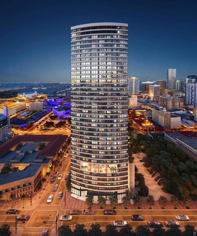 a tall building in a city at night at District 225 in Miami