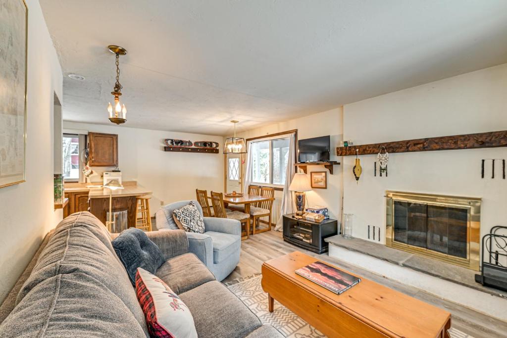 a living room with a couch and a fireplace at 3 Mi to Windham Mountain: Pet-Friendly Apt w/ Yard in Hensonville