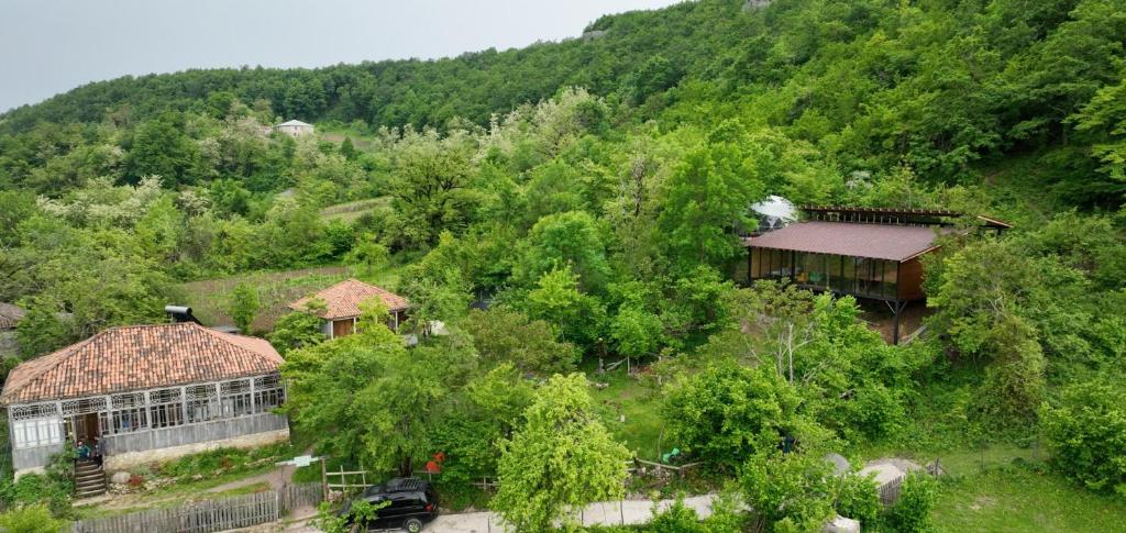 an aerial view of a house in the middle of a mountain at Sveri Adventure Camp in Chiatʼura