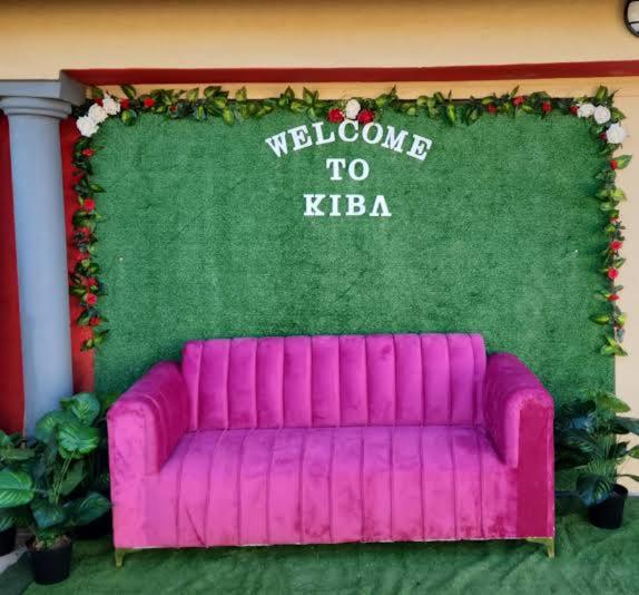 a purple couch in front of a welcome to keria at Kiba guest house in Marble Hall