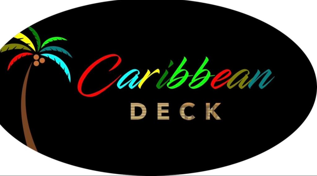 a sign with a palm tree and the words caribbean deck at Caribbean Deck Estate in Effort