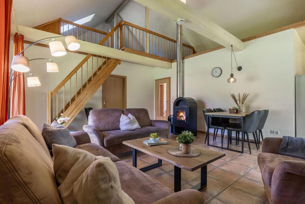 a living room with a couch and a table at Ferienhaus 3 in Fehmarn