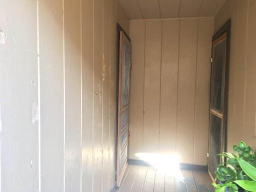 a room with a wall with two pictures on it at 424 E Levee Sreet #1 in Brownsville