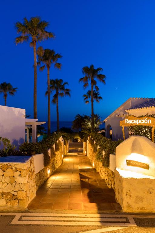 a pathway leading to a resort at night at Villas Etnia in Binissafuller