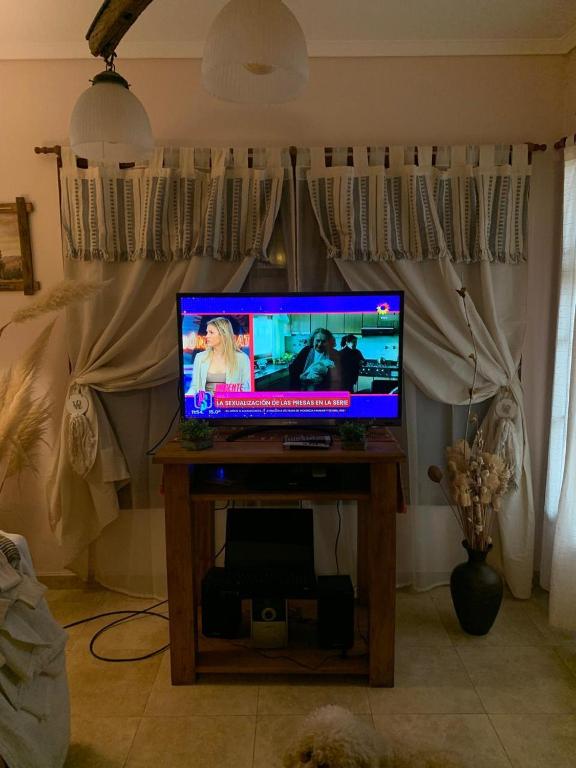 a television sitting on a table in a living room at MyM in Costa Azul