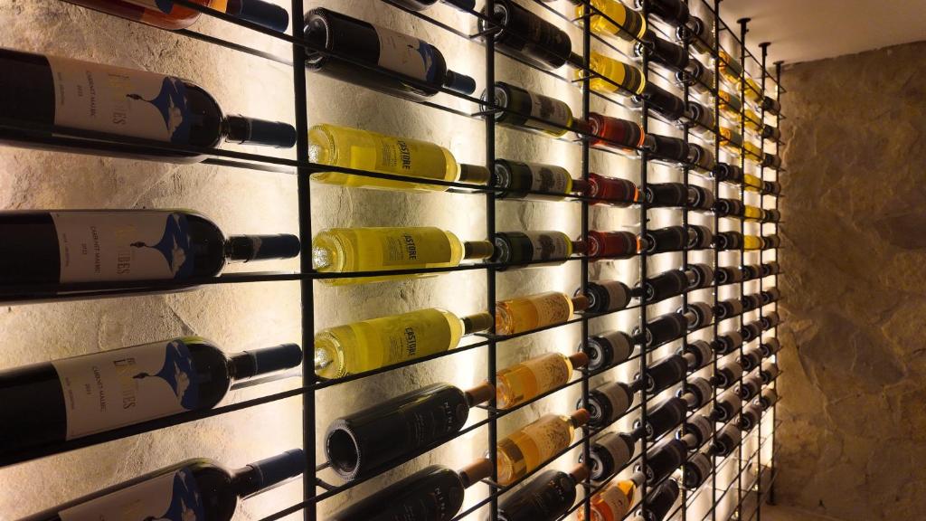 a wall of wine bottles in a wine cellar at Hotel Boutique Ubuntu in Buenos Aires