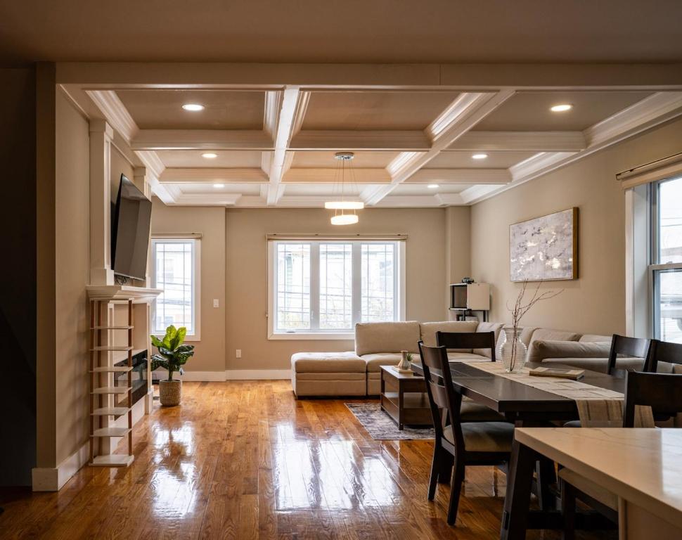 a living room with a couch and a table at 4BR5BA Luxury World Cup hub in North Bergen