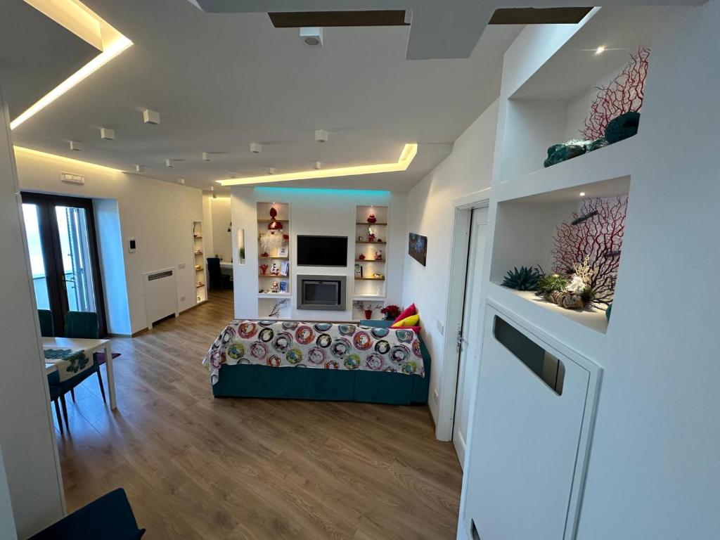 a large room with a bed and a living room at Maison Danielle in Vico Equense