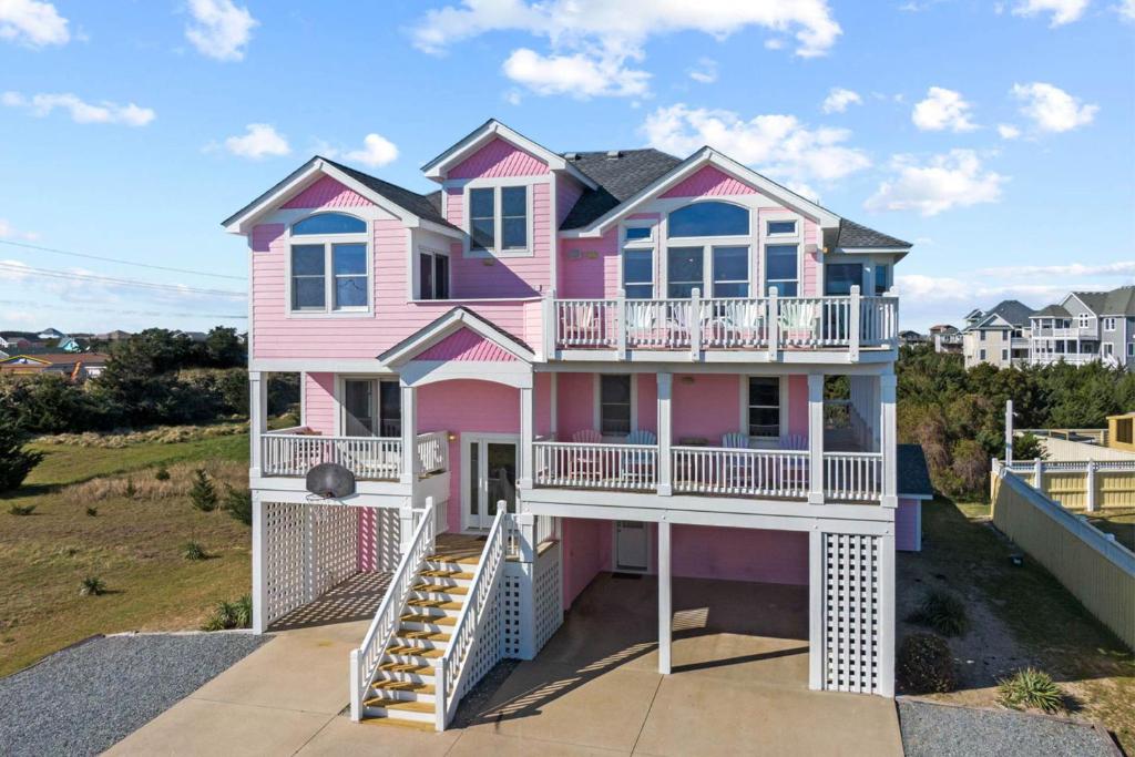 a pink house with a balcony at AV13 Time Away in Avon