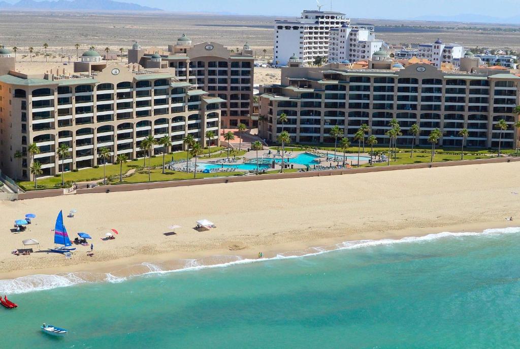 a view of a beach with hotels and the ocean at Oceanfront hideaway at Sonoran Spa N608 in Puerto Peñasco