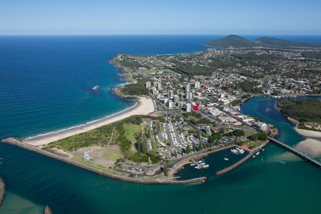 an aerial view of a small island in the ocean at Crystal Waters 7 Ocean Corridor Views, Restaurants, Town Centre in Forster