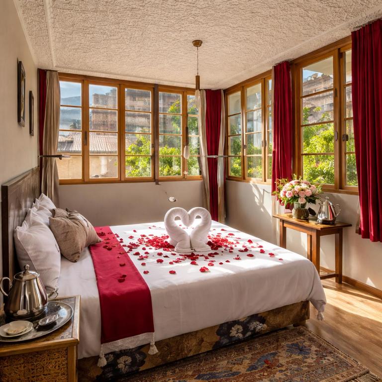 a bedroom with a bed with a heart decoration on it at Riad dreams imlil in Imlil