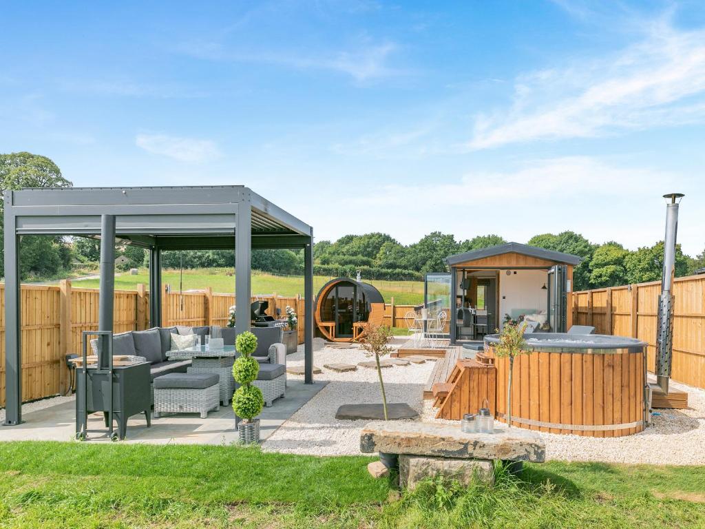 a patio with a gazebo in a yard at Barn Owl Lodge - Uk49903 in Appley Bridge