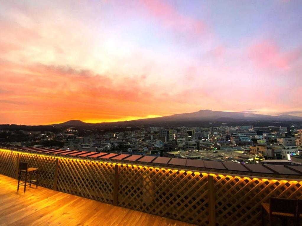 a view of a city from the roof of a building at Hotel Rest Seogwipo in Seogwipo