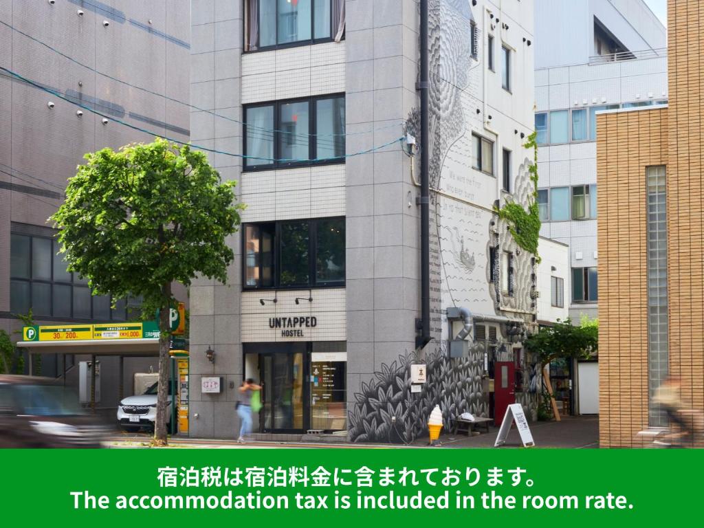 anatomization tax is included in the room rate in a building at Untapped Hostel in Sapporo
