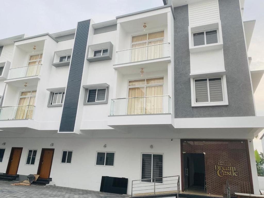 an exterior view of a white building at Dream Castle in Cochin